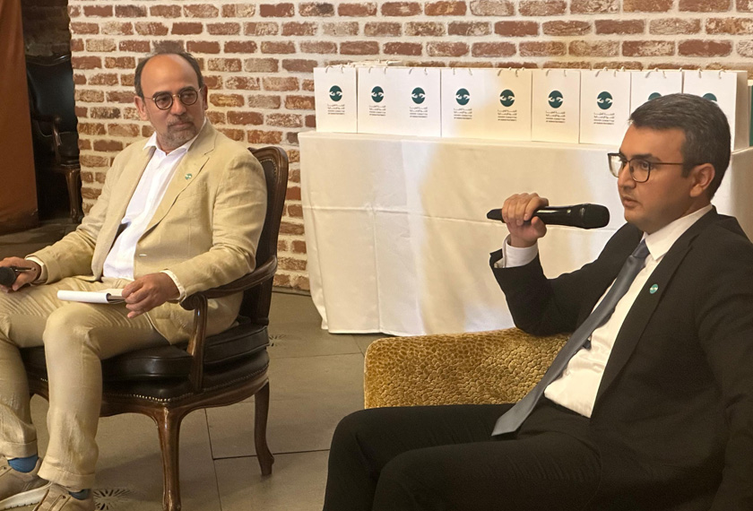 Two men at a forum